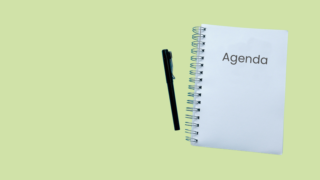 Vergrößerung des Bildes für Das Bilde zeigt einen Stift und ein Ringbuchheft mit dem Titel "Agenda"..
